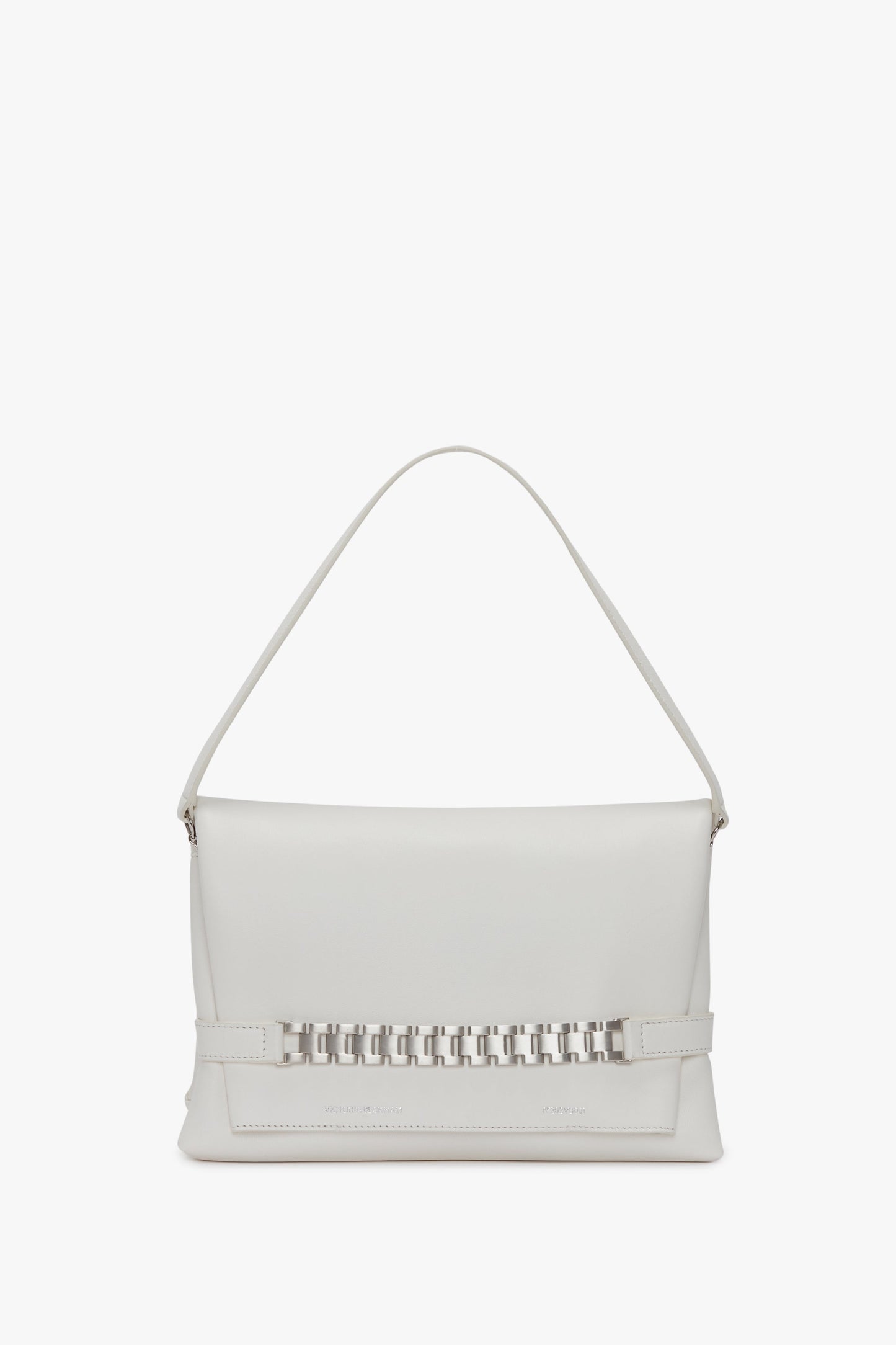 A Chain Pouch Bag with Brushed Silver Chain In White, featuring a decorative interlocking design at the center of its front flap, and adorned with silver Victoria Beckham branding.