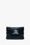 A folded black leather B Pouch Bag In Croc Effect Midnight Blue Leather by Victoria Beckham, displayed against a plain white background.