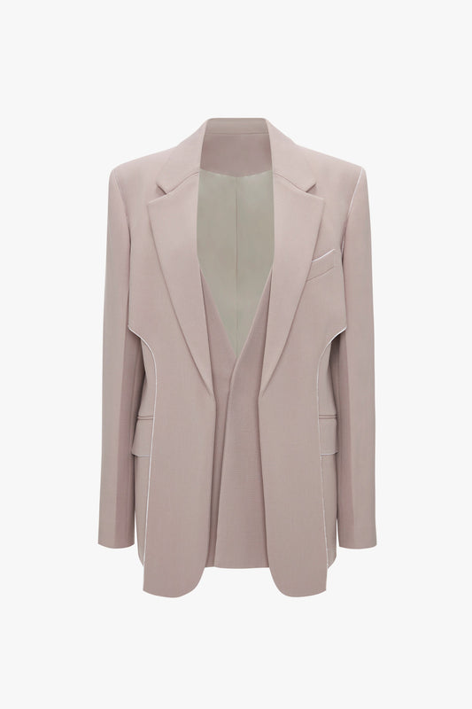 Victoria Beckham Double Panel Front Jacket In Rose Quartz with notched lapels, padded shoulders, a single chest pocket, and two front flap pockets. This classic tailored jacket is displayed on a white background.