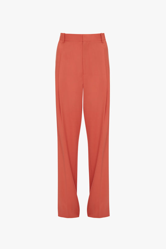 A pair of vibrant papaya-colored, high-waisted, wide-leg trousers with a front seam, belt loops, and a simple front closure from Victoria Beckham called the Single Pleat Trouser In Papaya.