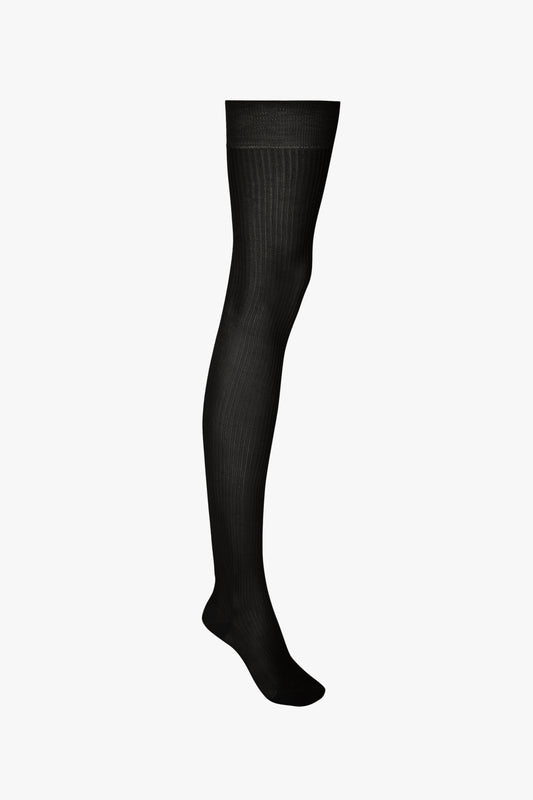 A single Exclusive over-the-knee sock in black displayed against a white background by Victoria Beckham.