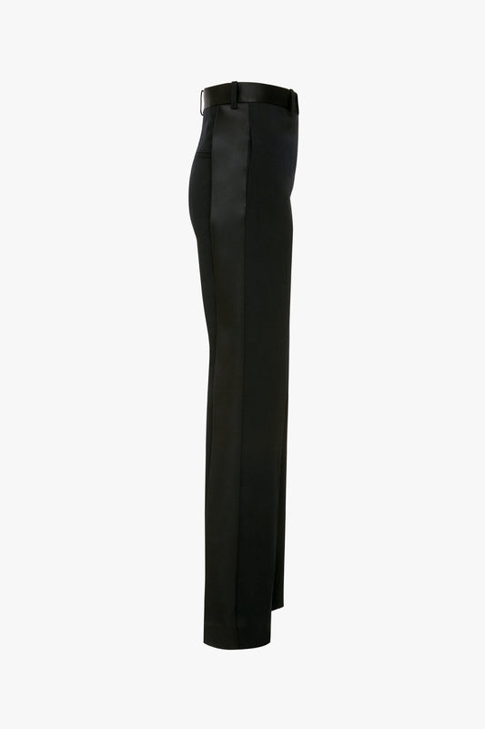 Side view of a pair of Victoria Beckham Satin Panel Straight Leg Trousers with a tailored fit and belt loops, featuring modern evening wear details and straight-leg trousers, against a white background.