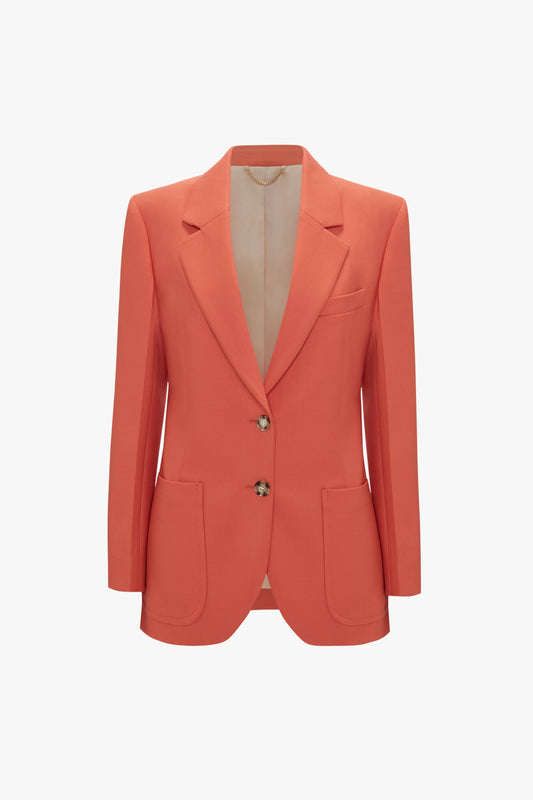 An orange women's blazer with a tailored fit, featuring a single-button closure and two patch pockets, displayed on a papaya-colored background.

Patch Pocket Jacket In Papaya by Victoria Beckham.