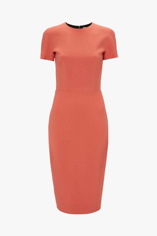 An elegant papaya fitted t-shirt dress by Victoria Beckham with short sleeves and a midi-length hem, displayed against a plain white background.