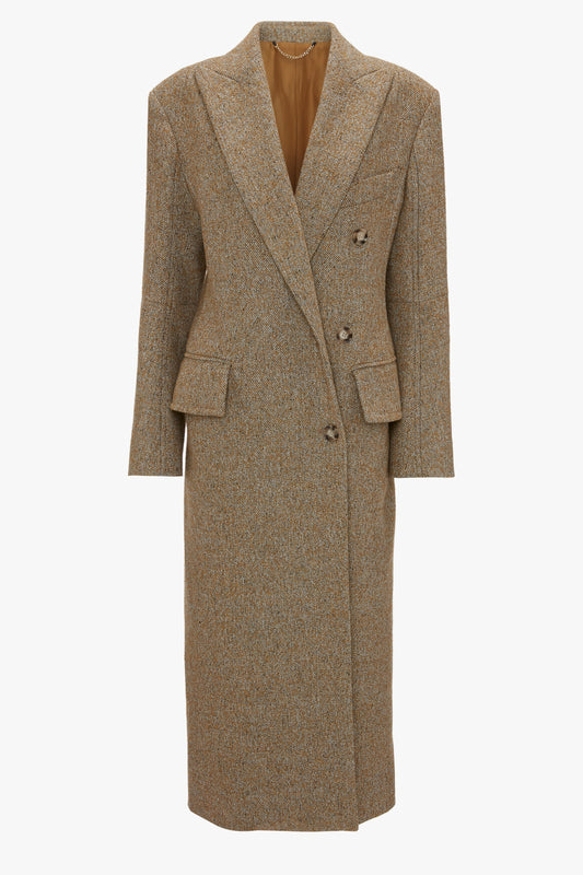 A long, brown tweed Victoria Beckham Exclusive Waisted Tailored Coat In Flax with a notched lapel, precision tailoring, two large buttons for closure, and flap pockets on either side.