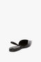 A V Cut Sling Back In Black Croc-Effect Leather by Victoria Beckham with a narrow, elasticated ankle strap at the back is shown from a rear angle against a white background.