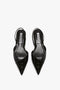 A pair of Victoria Beckham V Cut Sling Back In Black Croc-Effect Leather with a glossy finish and elasticated ankle straps, arranged side by side on a white background.