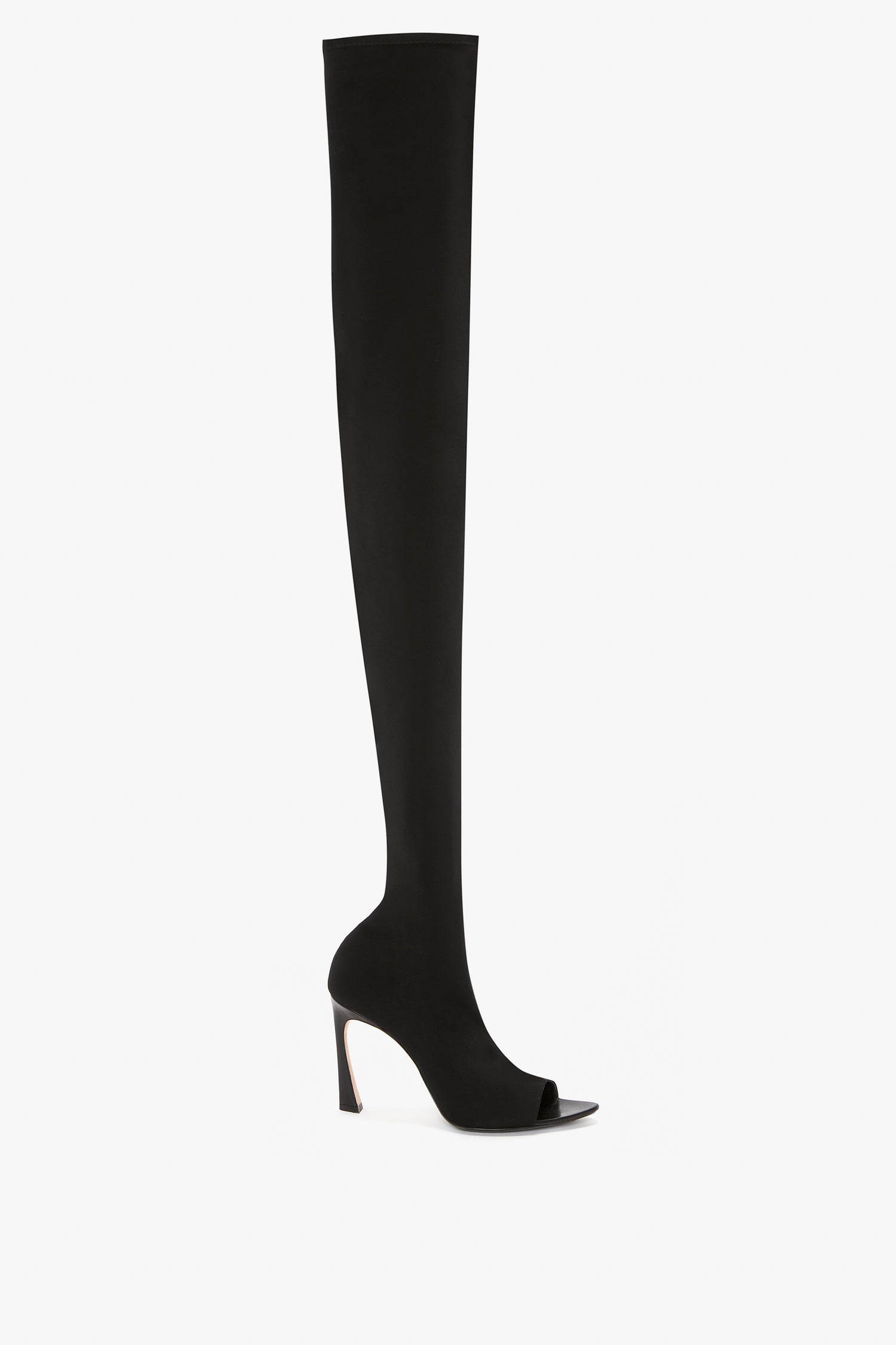 Black, thigh-high stiletto boot with an open toe design and high heel, viewed from the side against a plain white background. This sophisticated Peep Toe Stretch Jersey Boot In Black exudes elegance and style, reminiscent of Victoria Beckham footwear.
