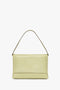 A Chain Pouch Bag With Strap In Avocado Leather by Victoria Beckham, displayed against a plain white background.