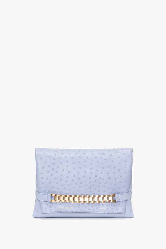 Sentence with replaced product name and brand name: Victoria Beckham Chain Pouch With Strap In Frost Ostrich-Effect Leather featuring a signature gold chain detail on the front, isolated on a white background.