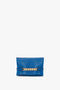 A Mini Chain Pouch Bag With Long Strap In Sapphire Blue with gold chain detail and "Victoria Beckham" text at the bottom, placed against a white background.