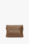 A Chain Pouch Bag With Strap In Khaki Leather by Victoria Beckham, crafted from luxurious Nappa leather, features a rectangular shape and minimalist design. It is shown against a plain white background. The bag includes a detachable strap for versatile styling options.