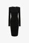 A Victoria Beckham Long Sleeve T-Shirt Fitted Dress In Black, featuring padded shoulders and a fitted waist, crafted from bi-stretch crepe with a rounded neckline against a white background.