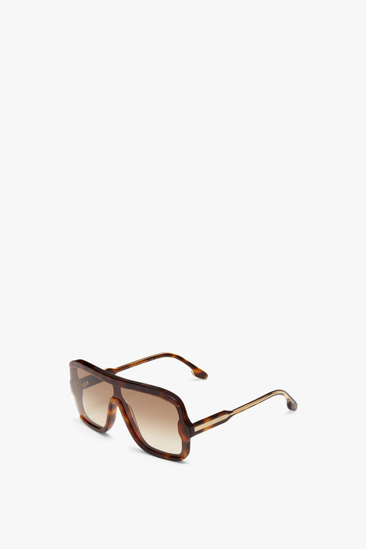 A pair of Victoria Beckham Layered Mask Sunglasses In Tortoise-Brown with graduated lenses and thin metallic arms, displayed on a white background.