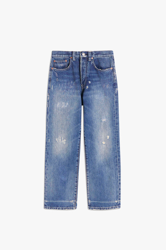 A pair of Victoria Beckham Victoria Mid-Rise Jean in Vintage Wash with light fading and slight fraying, featuring five pockets and a button-zip closure, laid flat on a white background.