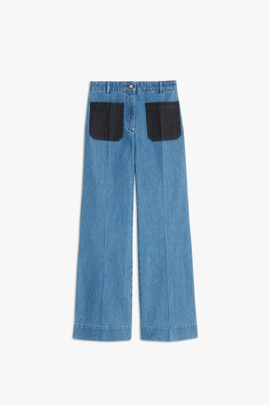 Alina High Waisted Patch Pocket Jean In 70s Wash by Victoria Beckham with a 70s wash and two black square pockets on the back, lying flat on a white background.