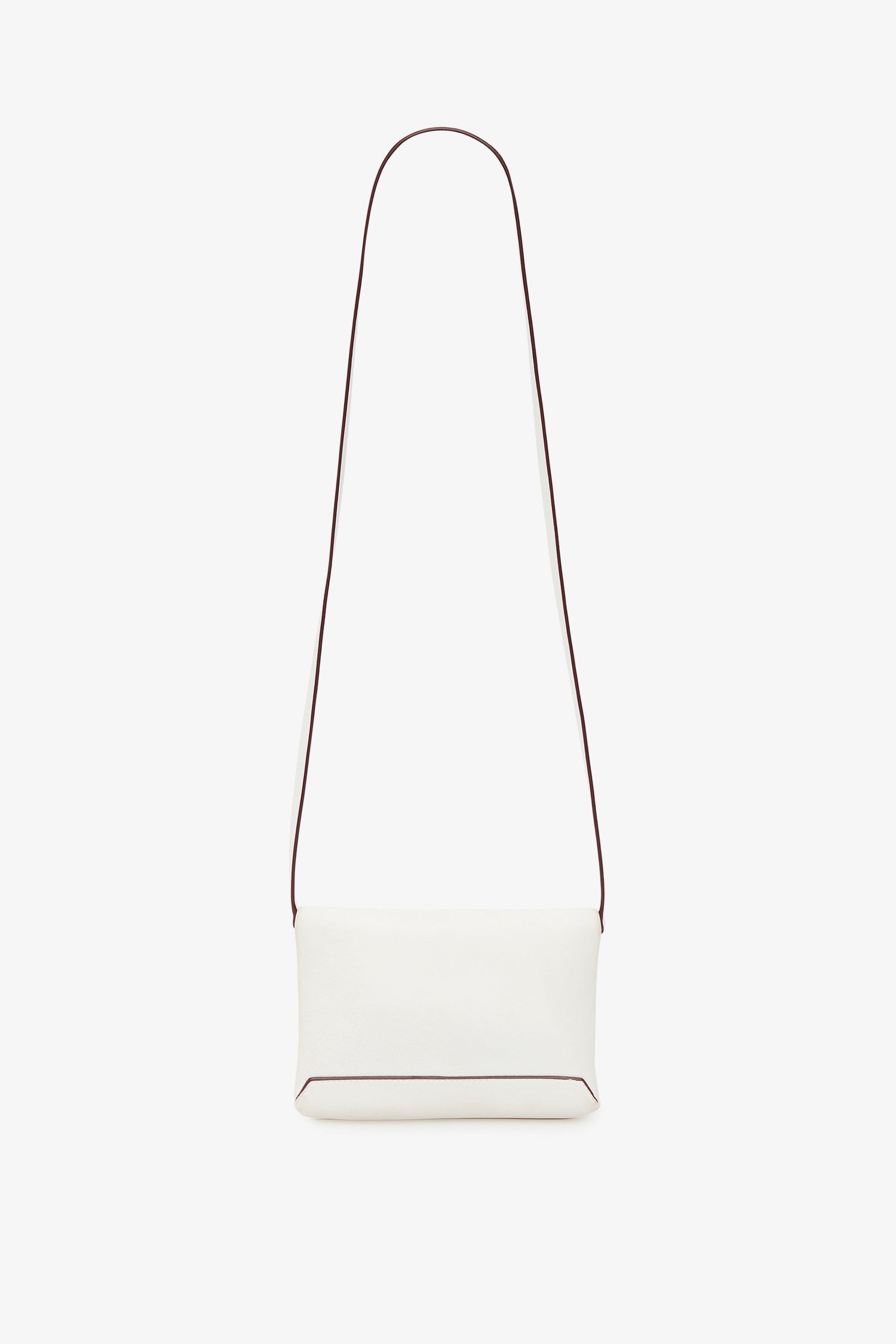 A chic white rectangular shoulder bag, reminiscent of Victoria Beckham's minimalist style, featuring a long, thin, removable strap. This Victoria Beckham Mini Chain Pouch Bag With Long Strap In White Leather is elegantly displayed against a plain white background.