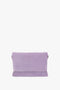 A Chain Pouch Bag with Strap in Lilac Suede by Victoria Beckham, crafted from Italian leather with a smooth texture, featuring a simple design and a flat bottom.