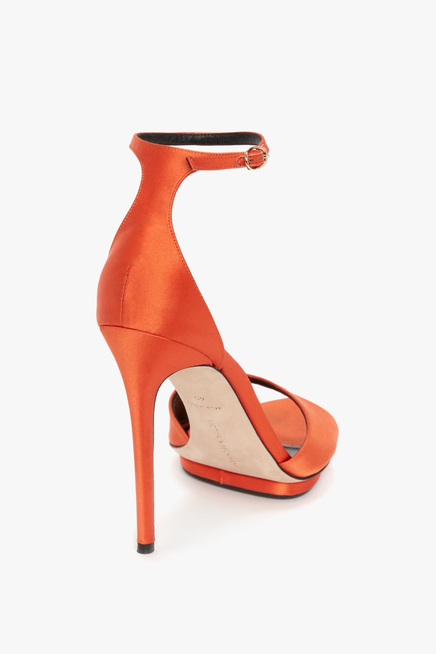 A single **Pointy Toe Stiletto Sandal in Orange Satin** by **Victoria Beckham** with an ankle strap and buckle on a white background, featuring a leg-lengthening platform sole.