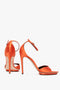 A pair of Pointy Toe Stiletto Sandal in Orange Satin by Victoria Beckham, crafted from a luxurious silk-satin blend fabric, is shown against a plain white background.