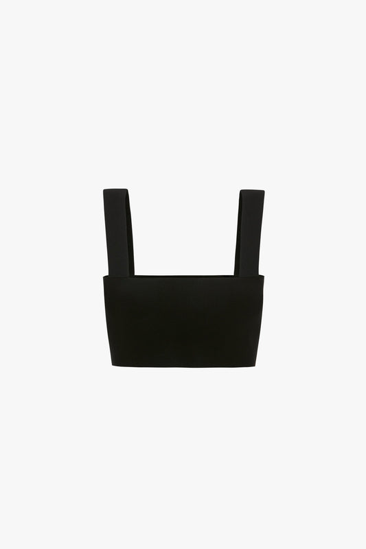 A Victoria Beckham VB Body Strap Bandeau Top In Black with wide straps and a squared neckline, featuring an ultra form-fitting knitwear design, displayed on a plain white background.