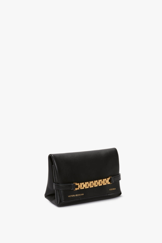 A sleek black Mini Chain Pouch Bag With Long Strap In Black Leather with a gold chain detail and "Victoria Beckham" inscribed in gold lettering.